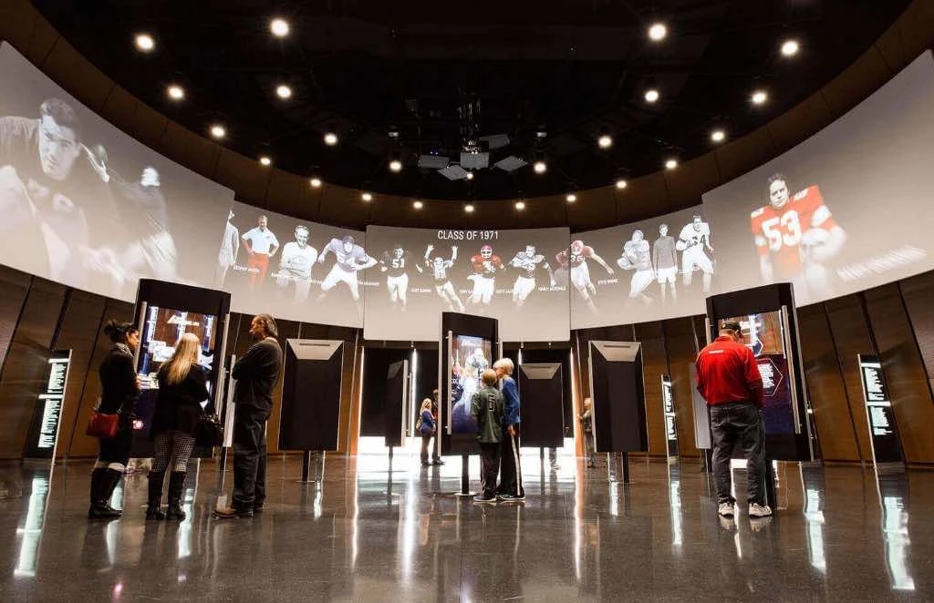 College Football Hall of Fame, rotunda with Class of 1971 projection and player kiosks
